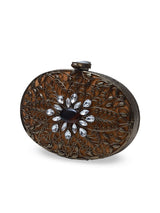 Mirza Brass Clutch by The Tan Clan featuring intricate embellishments and detailed craftsmanship.