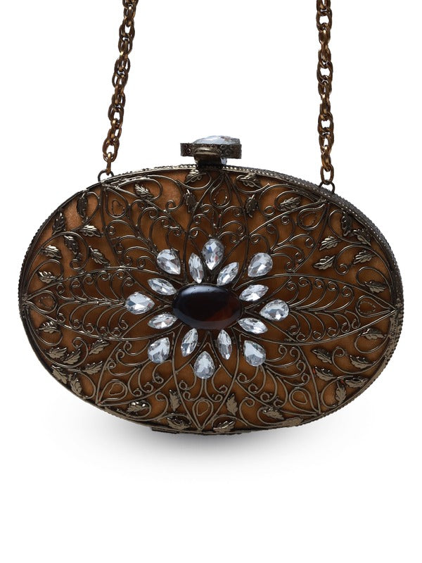 Mirza Brass Clutch by The Tan Clan featuring intricate embellishments and detailed craftsmanship.