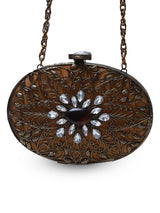Mirza Brass Clutch by The Tan Clan featuring intricate embellishments and detailed craftsmanship.