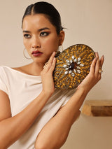 Mirza brass clutch by The Tan Clan featuring intricate embellishments and detailed craftsmanship, ideal for elegant occasions.