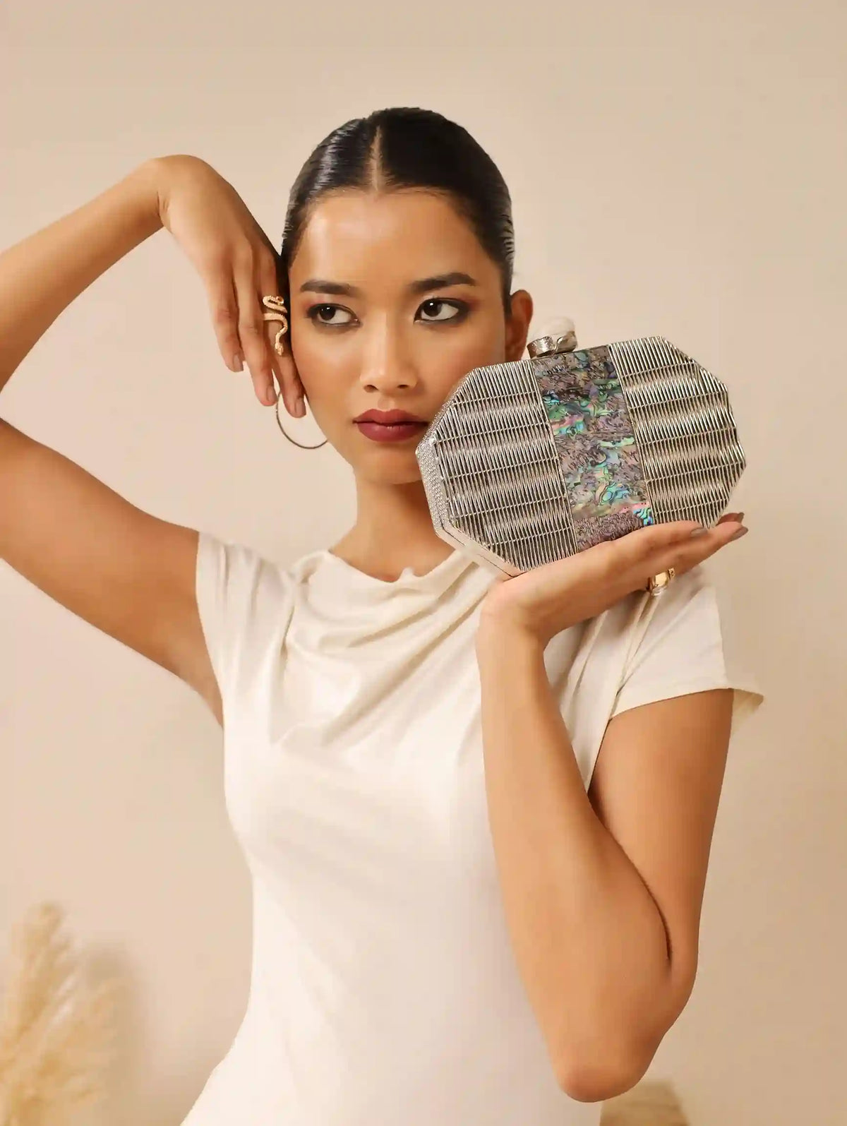 Silver mother of pearl clutch bag by The Tan Clan with a sleek, elegant design and subtle shimmer for evening accessories.