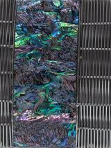 Silver mother of pearl clutch bag with a sleek design from The Tan Clan, featuring a shiny, reflective surface and elegant style.