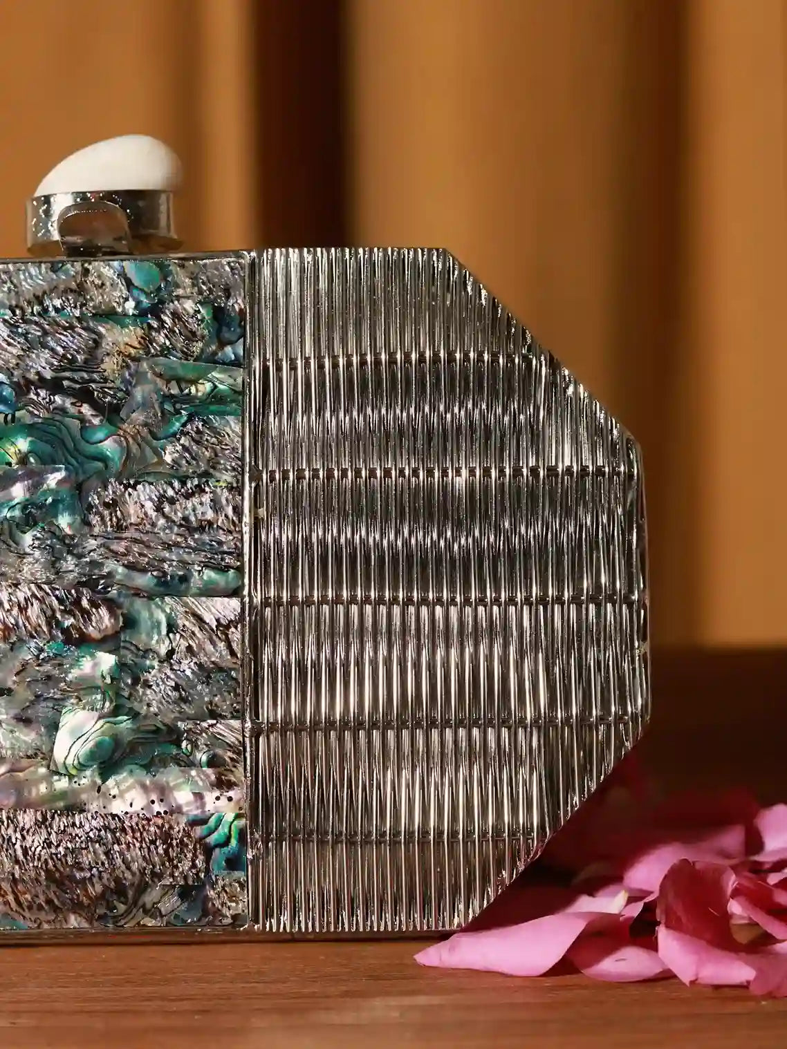 Silver mother of pearl clutch bag by The Tan Clan, featuring elegant design and compact size for evening occasions.