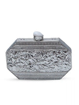 Silver mother of pearl clutch bag with a sleek design from The Tan Clan, featuring a smooth, reflective surface and elegant style.