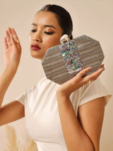 Misha Silver Mother of Pearl Clutch by The Tan Clan featuring a shimmering silver exterior and elegant mother of pearl design.
