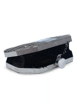 Silver mother of pearl clutch purse with elegant design by The Tan Clan, featuring a sleek, shiny exterior and compact size.
