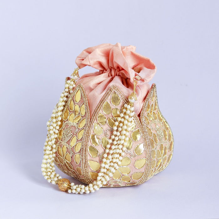 Mini lotus-shaped potli bag with intricate Gota Patti handwork by The Tan Clan, featuring delicate embroidery and traditional design.
