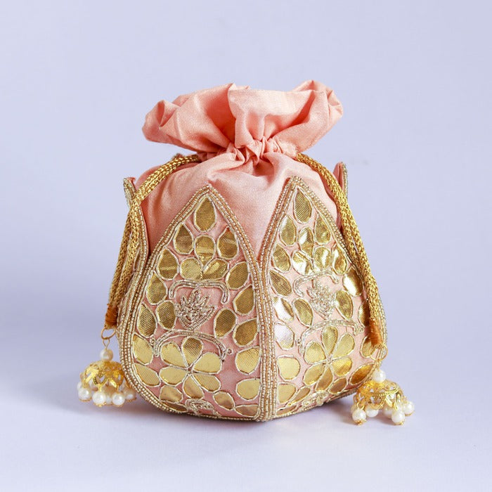 Mini lotus-shaped potli bag with intricate gota patti handwork by The Tan Clan, featuring delicate embroidery and a traditional design.