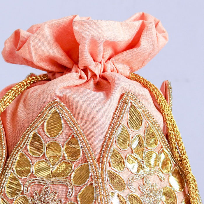 Mini lotus-shaped potli bag with intricate gota patti handwork by The Tan Clan, featuring traditional embroidery and a drawstring closure.