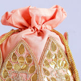 Mini lotus-shaped potli bag with intricate gota patti handwork by The Tan Clan, featuring traditional embroidery and a drawstring closure.