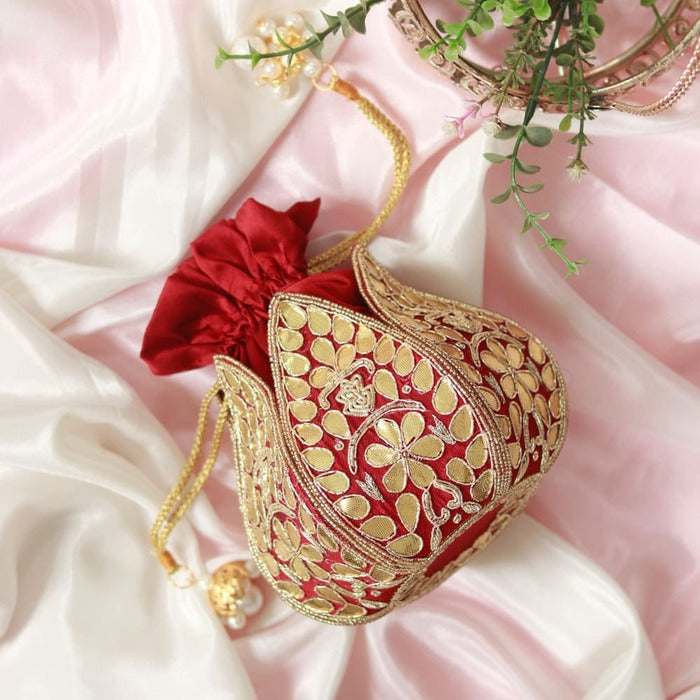 Mini lotus-shaped potli bag with intricate Gota Patti handwork by The Tan Clan, featuring delicate embroidery and traditional design.