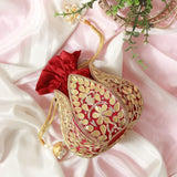 Mini lotus-shaped potli bag with intricate Gota Patti handwork by The Tan Clan, featuring delicate embroidery and traditional design.