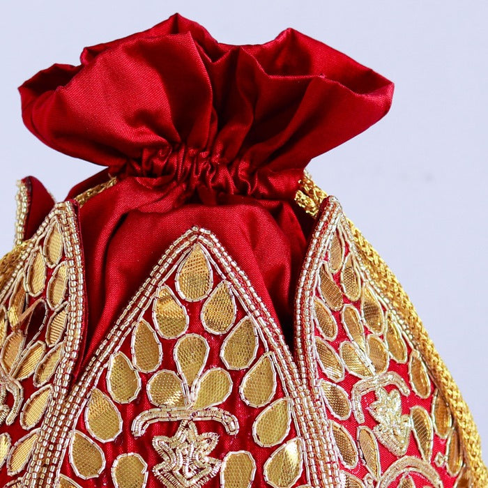 Mini lotus-shaped potli bag by The Tan Clan featuring intricate Mrig Gota Patti handwork and traditional design.