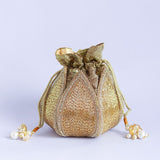 Hand-embroidered mini lotus potli bag by The Tan Clan with intricate floral embroidery and traditional drawstring closure.