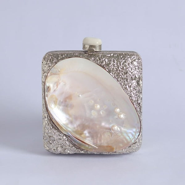 Elegant Mumtaz mother of pearl clutch by The Tan Clan, featuring intricate pearl detailing and a sleek, compact design.