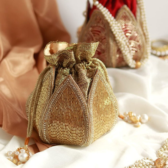 Hand-embroidered mini lotus potli bag by The Tan Clan, featuring intricate embroidery and traditional design for elegant occasions.