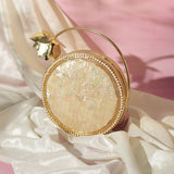 Naaz embellished mother of pearl clutch by The Tan Clan, featuring intricate pearl detailing and elegant design.