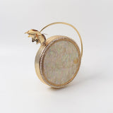 Naaz embellished mother of pearl clutch by The Tan Clan, featuring intricate pearl design and elegant gold accents.