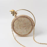Naaz embellished mother of pearl clutch by The Tan Clan, featuring intricate design and shimmering pearl accents.