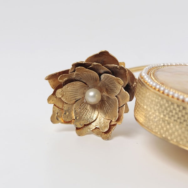 Naaz embellished mother of pearl clutch bag by The Tan Clan with intricate beadwork and elegant design for special occasions.