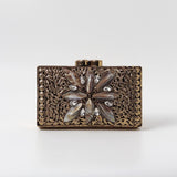Nadia embellished mother of pearl clutch by The Tan Clan featuring intricate pearl detailing and a sleek, elegant design.