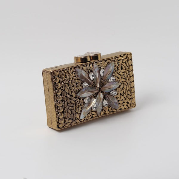 Nadia Embellished Mother of Pearl Clutch by The Tan Clan with intricate beadwork and a sleek, elegant design.