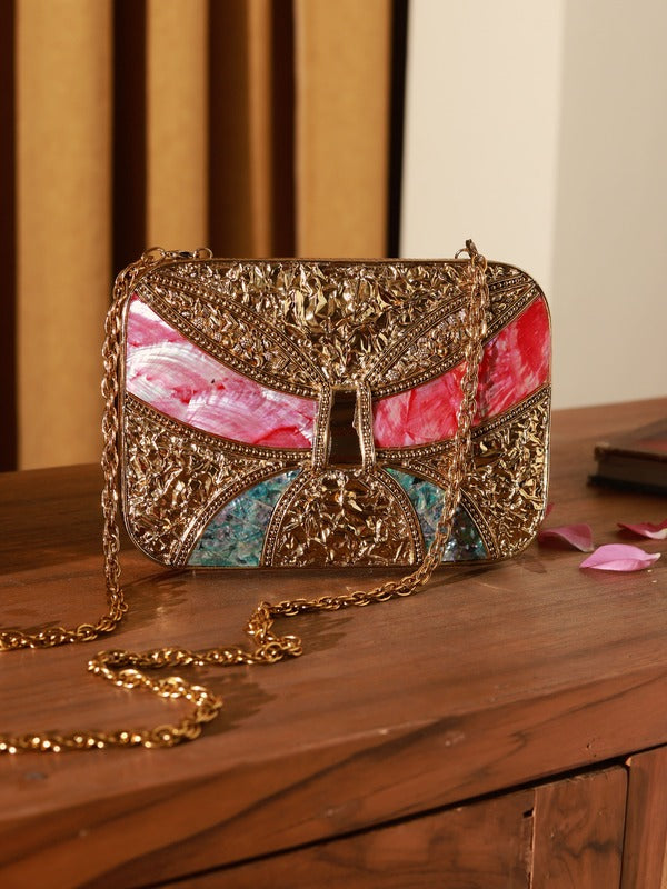 Naina Mother of Pearl Clutch by The Tan Clan featuring iridescent pearl detailing and a sleek, elegant design.
