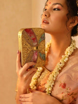 Mother of pearl clutch purse by The Tan Clan featuring a sleek, elegant design with a glossy, iridescent surface.