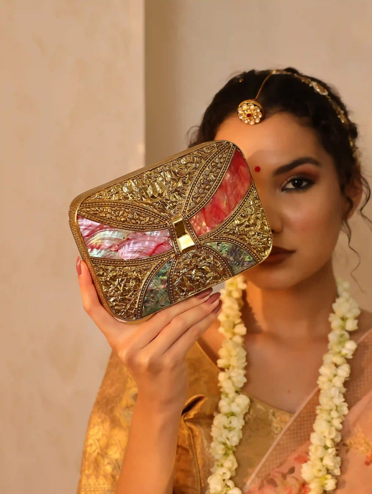 Naina Mother of Pearl Clutch by The Tan Clan, elegant evening bag with iridescent mother of pearl finish and sleek design.