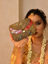 Naina Mother of Pearl Clutch by The Tan Clan, elegant evening bag with iridescent mother of pearl finish and sleek design.