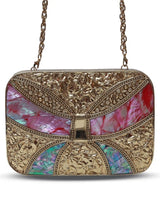 Naina Mother of Pearl Clutch by The Tan Clan featuring a shimmering pearl exterior and elegant design.