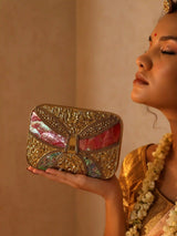 Naina Mother of Pearl Clutch by The Tan Clan featuring a shimmering pearl surface and sleek design for elegant occasions.