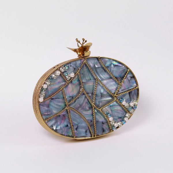 Nargis embellished mother of pearl clutch by The Tan Clan featuring intricate beadwork and a sleek, elegant design.