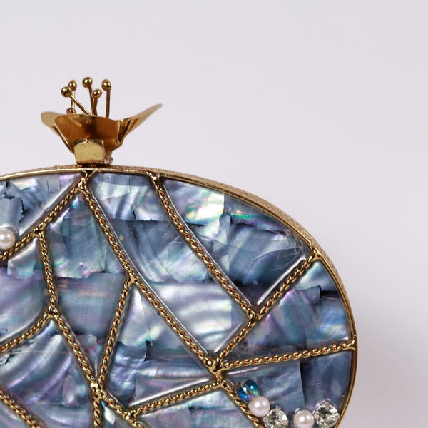 Nargis embellished mother of pearl clutch with intricate beadwork and elegant design by The Tan Clan.
