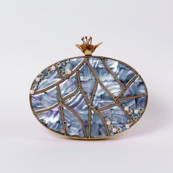 Nargis embellished mother of pearl clutch bag by The Tan Clan with intricate beadwork and elegant design.