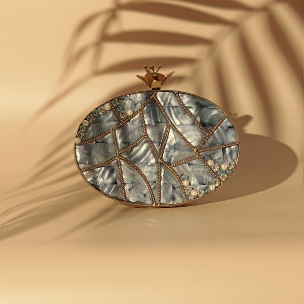 Nargis embellished Mother of Pearl clutch bag with intricate beadwork and metallic accents by The Tan Clan.