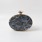 Nargis embellished mother of pearl clutch by The Tan Clan with intricate detailing and a sleek, elegant design.