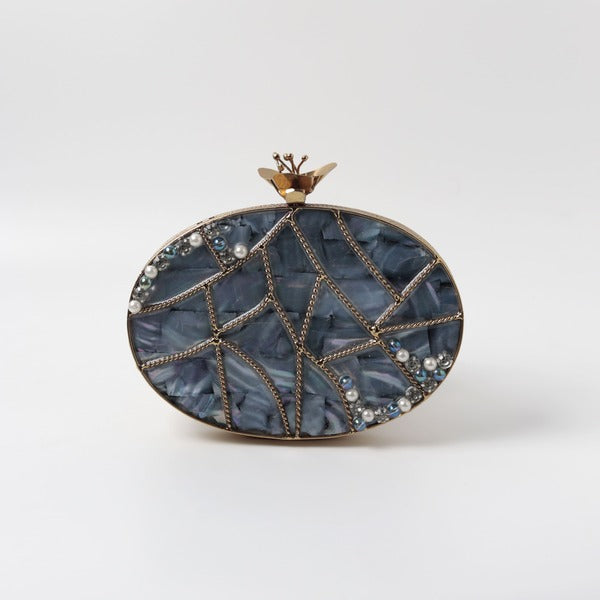 Nargis embellished mother of pearl clutch by The Tan Clan featuring intricate beadwork and elegant design.