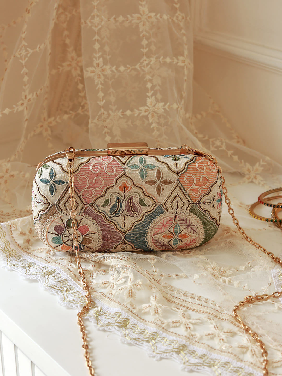 Navratri special edition combo featuring a Mughal long clutch and Swarn mini lotus potli from THE TAN CLAN.