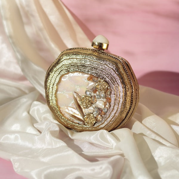 Nazakat Combo: Sana mother of pearl clutch and Twinkle gold potli bag by THE TAN CLAN, featuring elegant designs and intricate detailing.