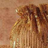 Nazakat Combo featuring Sana Mother of Pearl clutch and Twinkle Gold Potli Bag from THE TAN CLAN, showcasing elegant traditional accessories.