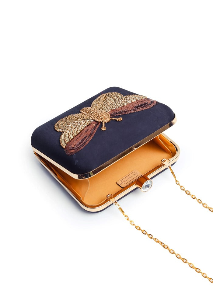 Nigah Black Square Hand Embroidered Butterfly Clutch by The Tan Clan, featuring intricate embroidery and a sleek design.