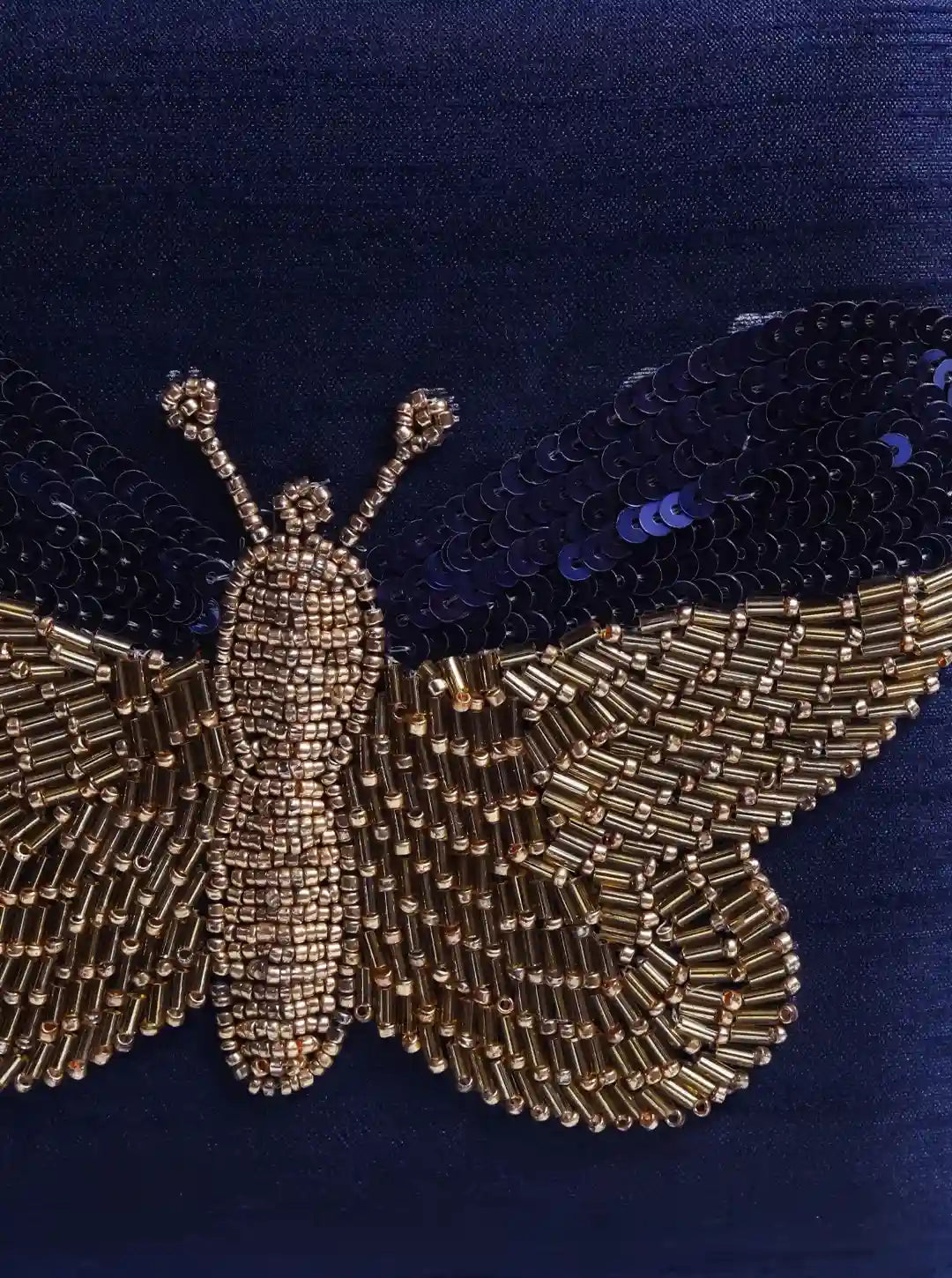 Square Nigah Butterfly Clutch by The Tan Clan featuring hand embroidery and vibrant butterfly design.