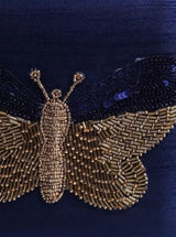 Square Nigah Butterfly Clutch by The Tan Clan featuring hand embroidery and vibrant butterfly design.