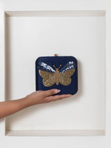 Nigah square hand-embroidered butterfly clutch by The Tan Clan featuring intricate embroidery on a stylish square design.