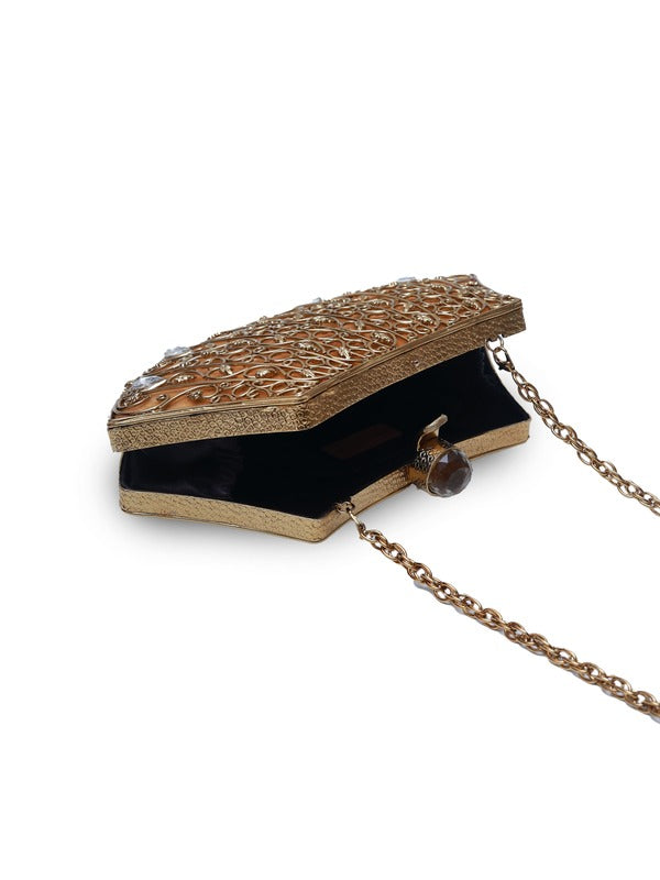 Intricate brass clutch bag with detailed embellishments from The Tan Clan, showcasing its elegant design and craftsmanship.