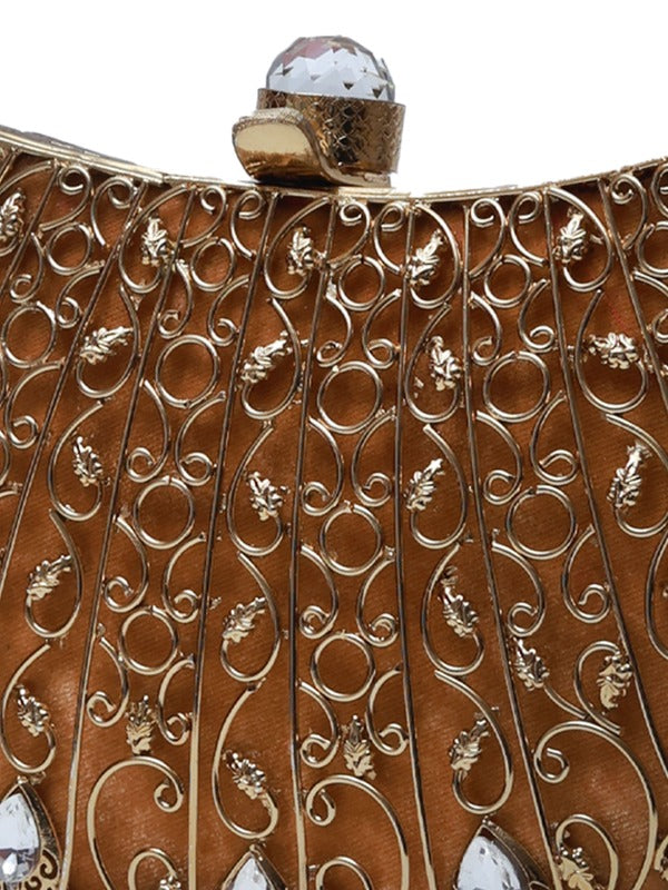 Nitya brass clutch by The Tan Clan with intricate embellishments and detailed craftsmanship, showcasing traditional design and metallic finish.