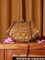 Intricate brass clutch with detailed embellishments from The Tan Clan, featuring traditional craftsmanship and elegant design.