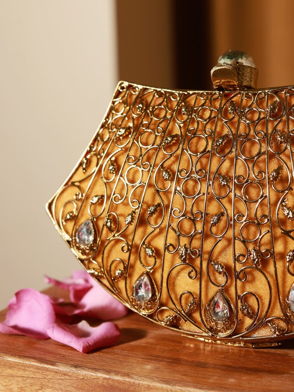 Intricate embellished brass clutch by The Tan Clan with detailed craftsmanship and elegant design.
