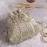 Noor combo featuring a mother of pearl clutch and silver potli bag, elegant accessories from THE TAN CLAN.